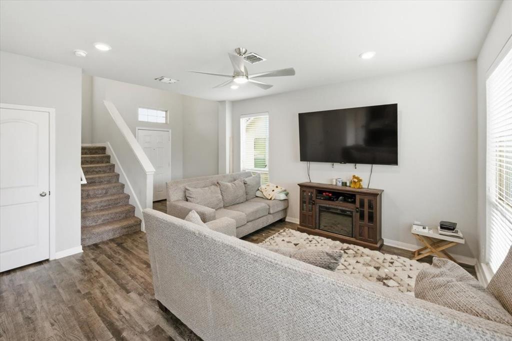 10701 Kestrel Court Waco, TX 76708 - Photo 3 of 37 Living room with ceiling fan, wood-look floors, and recessed LED lighting
