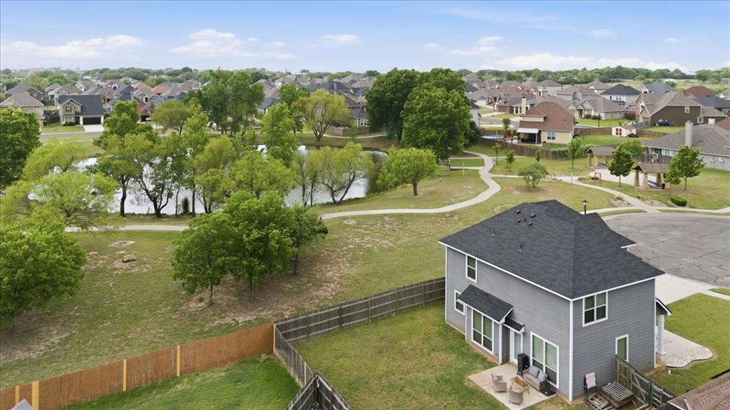 10701 Kestrel Court Waco, TX 76708 - Photo 30 of 37 Aerial view showing the home with the neighborhood pond, walking area, and picnic area in the background