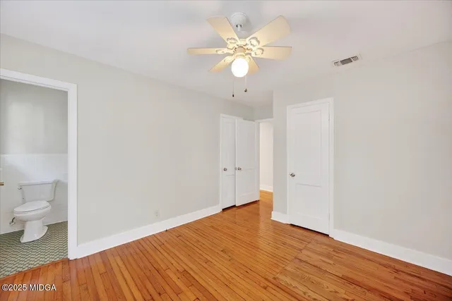a view of a room with wooden floor and sink