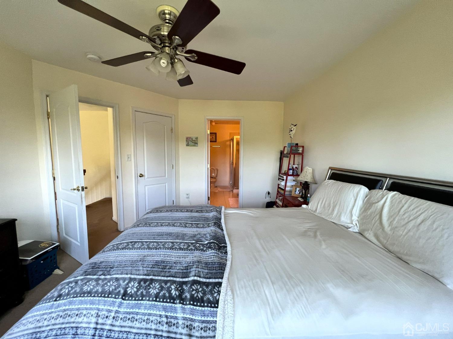 310 Hawthorne Road North Brunswick, NJ 08902 - Photo 17 of 25 a bedroom with a bed and a chandelier