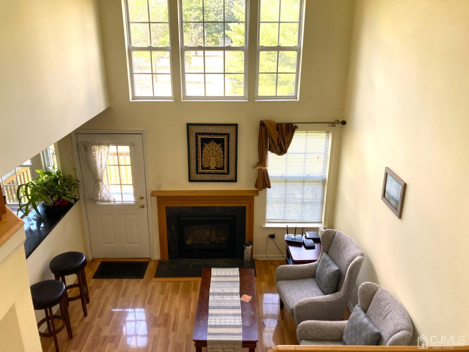 310 Hawthorne Road North Brunswick, NJ 08902 - Photo 18 of 25 a living room with furniture windows and a fireplace