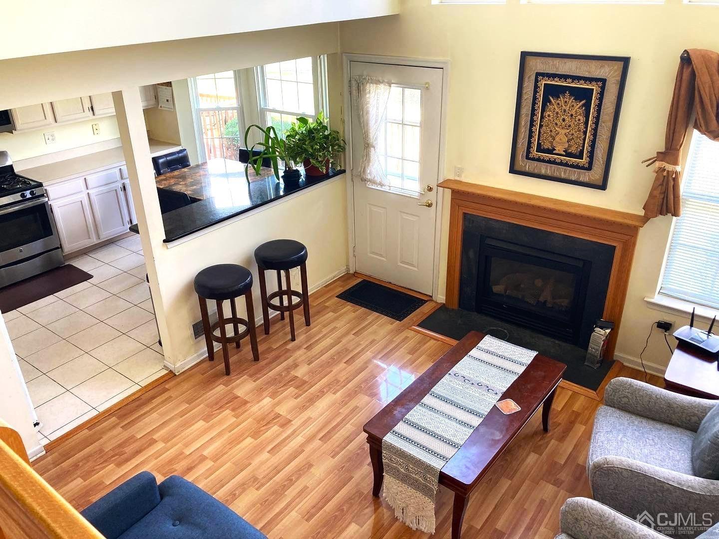 310 Hawthorne Road North Brunswick, NJ 08902 - Photo 2 of 25 a living room with furniture and a fireplace