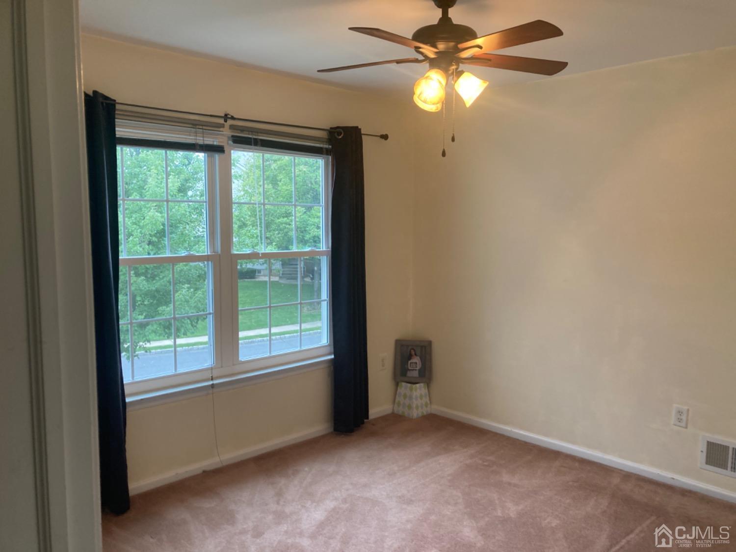 310 Hawthorne Road North Brunswick, NJ 08902 - Photo 22 of 25 a view of room with window and ceiling fan