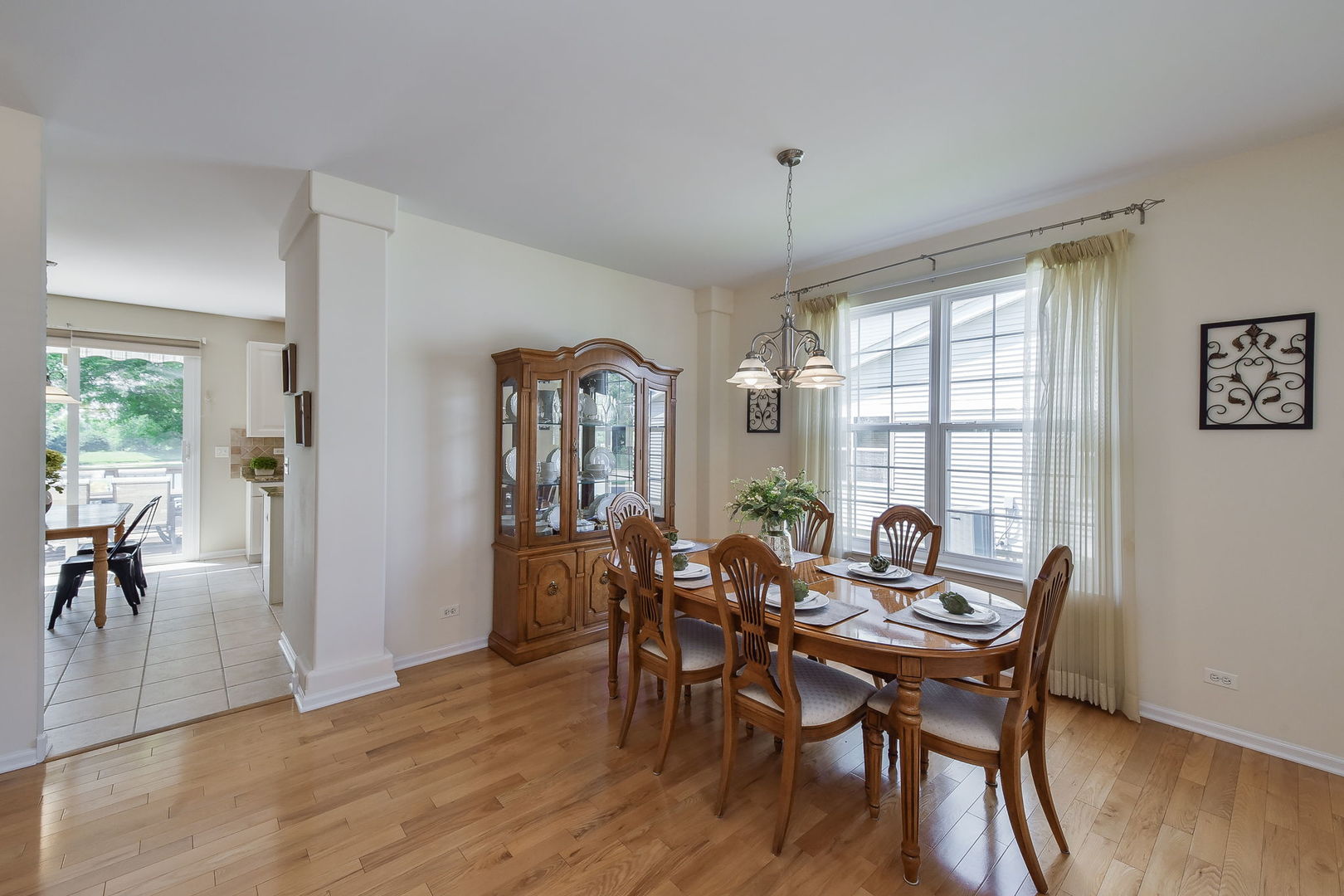 1699 Montclair Drive Elgin, IL 60123 - Photo 13 of 30 a view of a dining room with furniture window and wooden floor