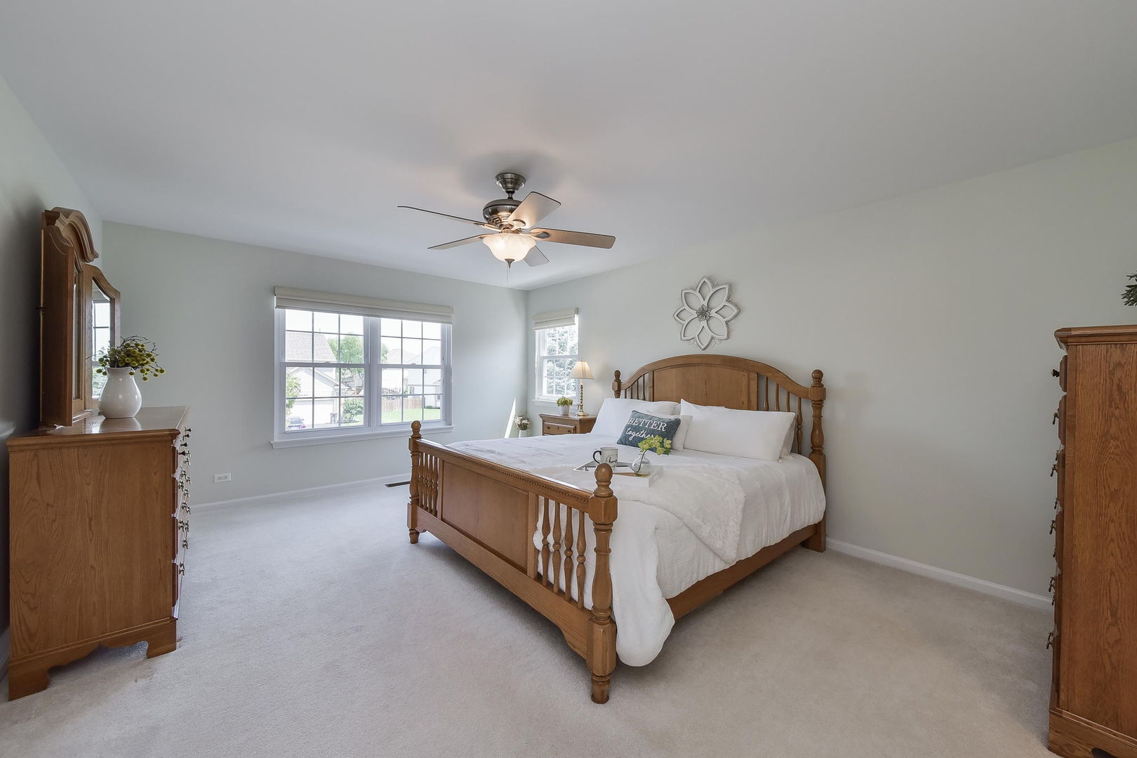 1699 Montclair Drive Elgin, IL 60123 - Photo 16 of 30 a bedroom with a bed chandelier and a window