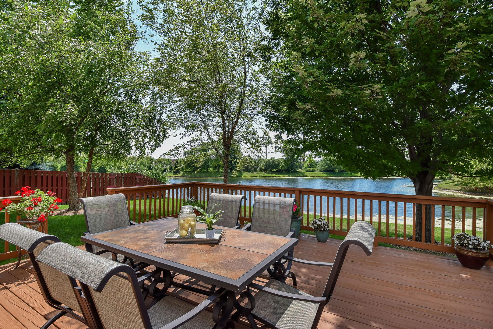 1699 Montclair Drive Elgin, IL 60123 - Photo 24 of 30 a view of a table and chairs on the roof deck