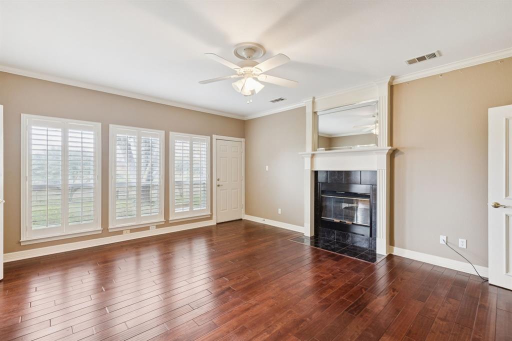 1250 Eubanks Road Seagoville, TX 75159 - Photo 21 of 40 Light and Bright primary bedroom with with cozy fireplace.