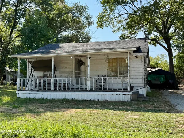 a view of house with yard in front of it