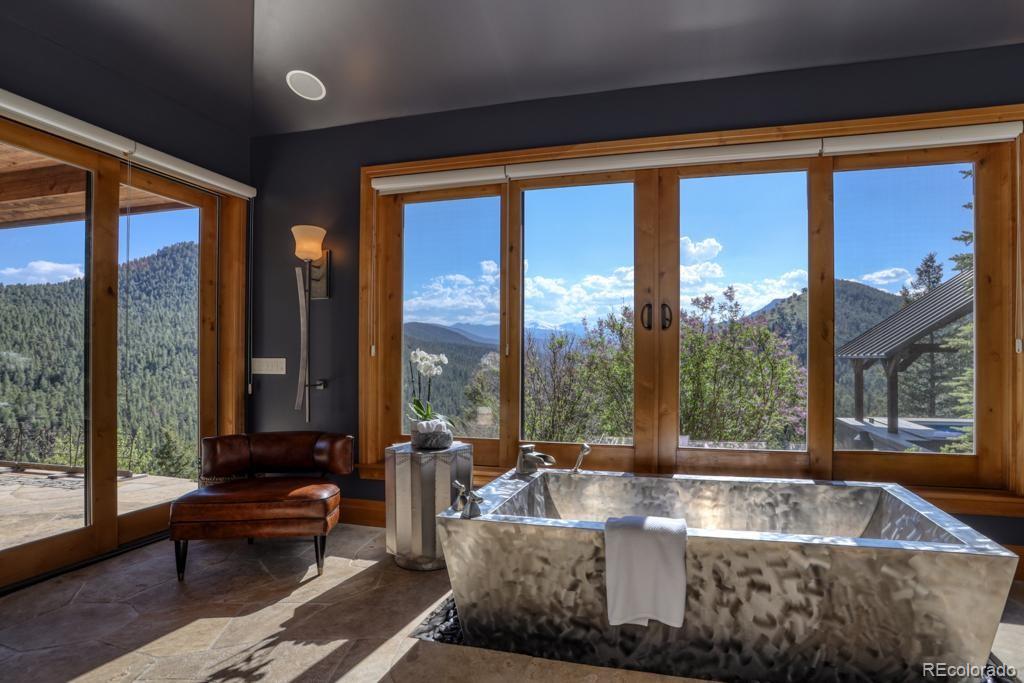 3731 Overlook Trail Evergreen, CO 80439 - Photo 14 of 35 a living room with couch and a large window
