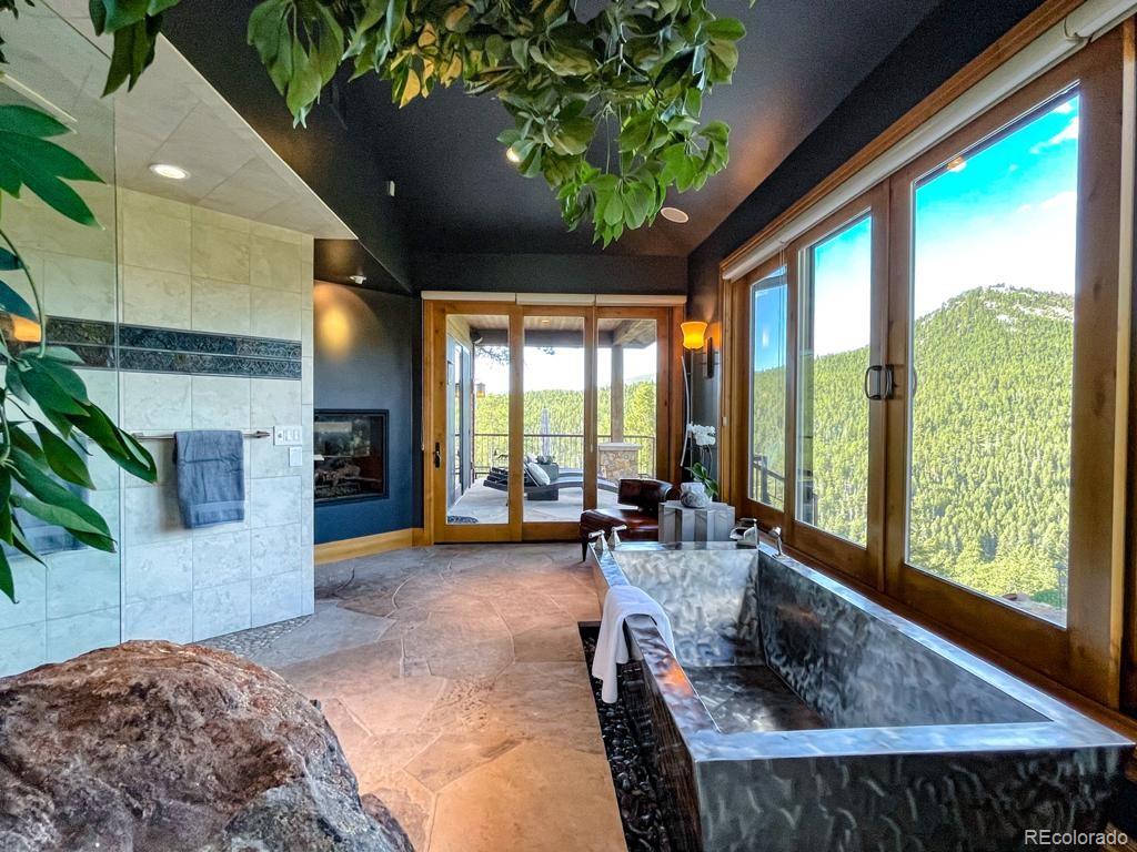3731 Overlook Trail Evergreen, CO 80439 - Photo 15 of 35 a living room filled with furniture and a large window