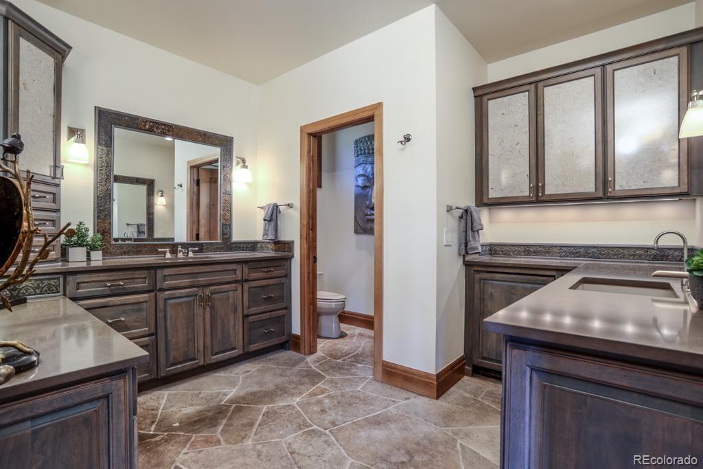 3731 Overlook Trail Evergreen, CO 80439 - Photo 18 of 35 a kitchen with a sink and a refrigerator