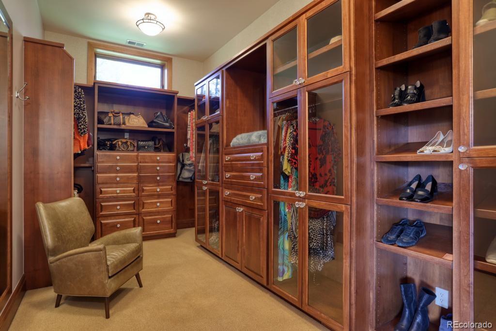 3731 Overlook Trail Evergreen, CO 80439 - Photo 19 of 35 a view of walk in closet with clothes and shoes
