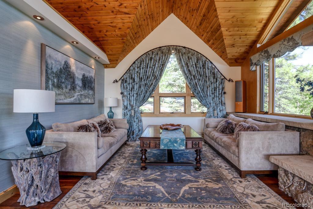 3731 Overlook Trail Evergreen, CO 80439 - Photo 6 of 35 a living room with furniture and a large window