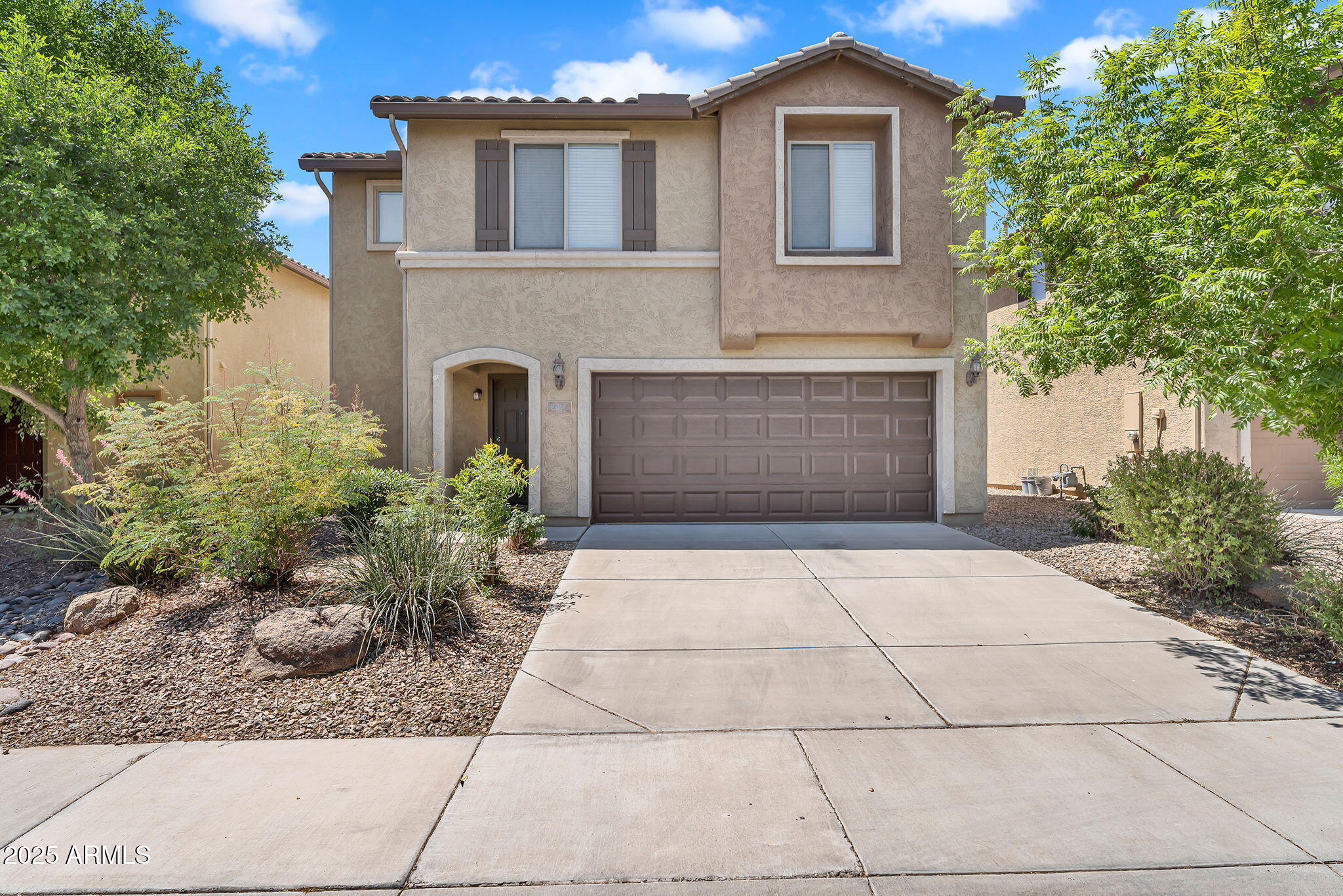8071 West Georgetown Way Florence, AZ 85132 - Photo 1 of 43 a front view of a house with garden
