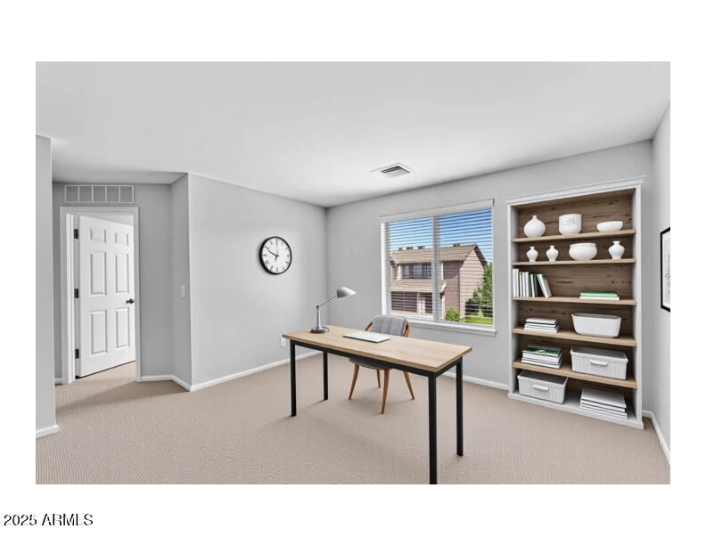 8071 West Georgetown Way Florence, AZ 85132 - Photo 13 of 43 a living room with furniture and a book shelf