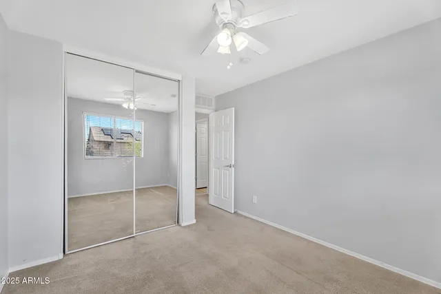 a view of an empty room with a glass door