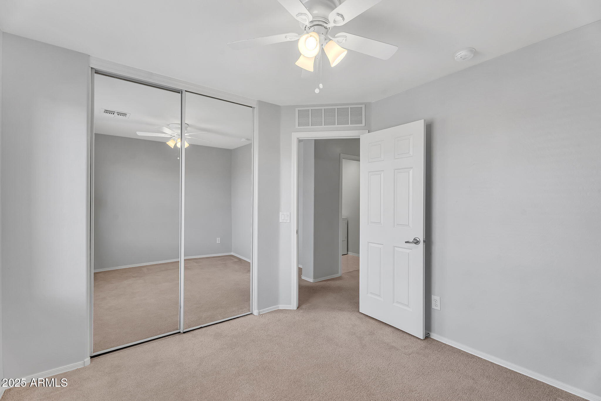 8071 West Georgetown Way Florence, AZ 85132 - Photo 22 of 43 a view of an empty room with a fan