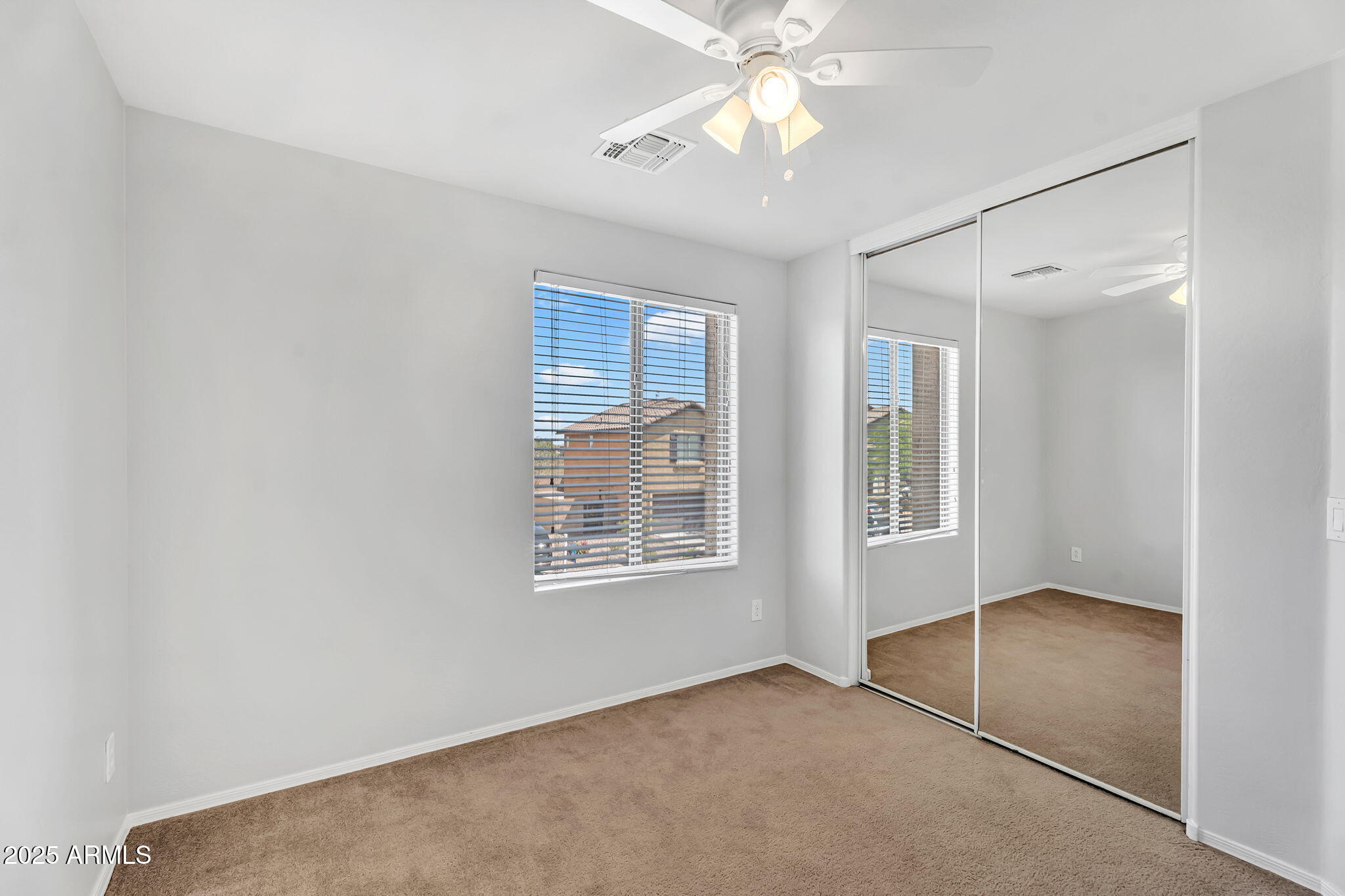 8071 West Georgetown Way Florence, AZ 85132 - Photo 24 of 43 a view of an empty room with a window