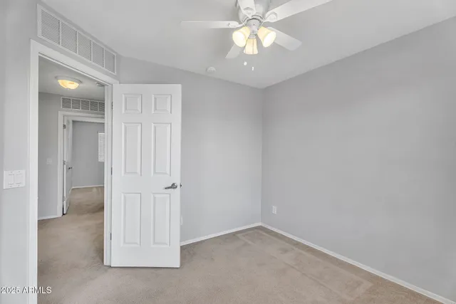 an empty room with a bathroom