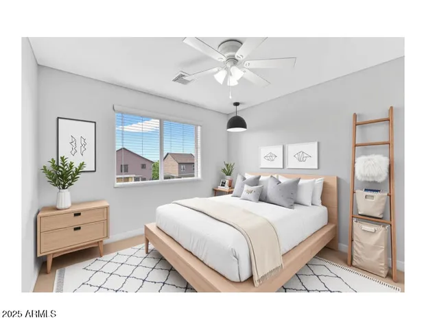 a bedroom with a bed potted plant with the view of bathroom