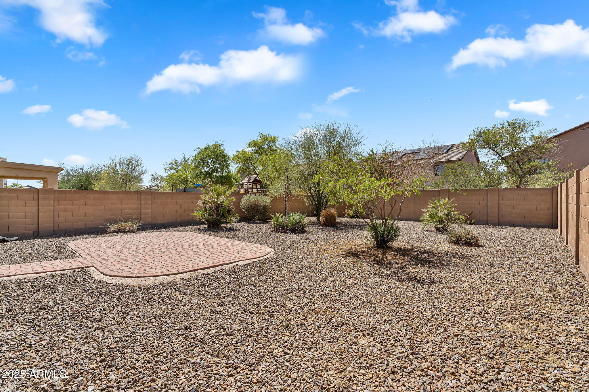 8071 West Georgetown Way Florence, AZ 85132 - Photo 32 of 43 a backyard of a house with table and chairs