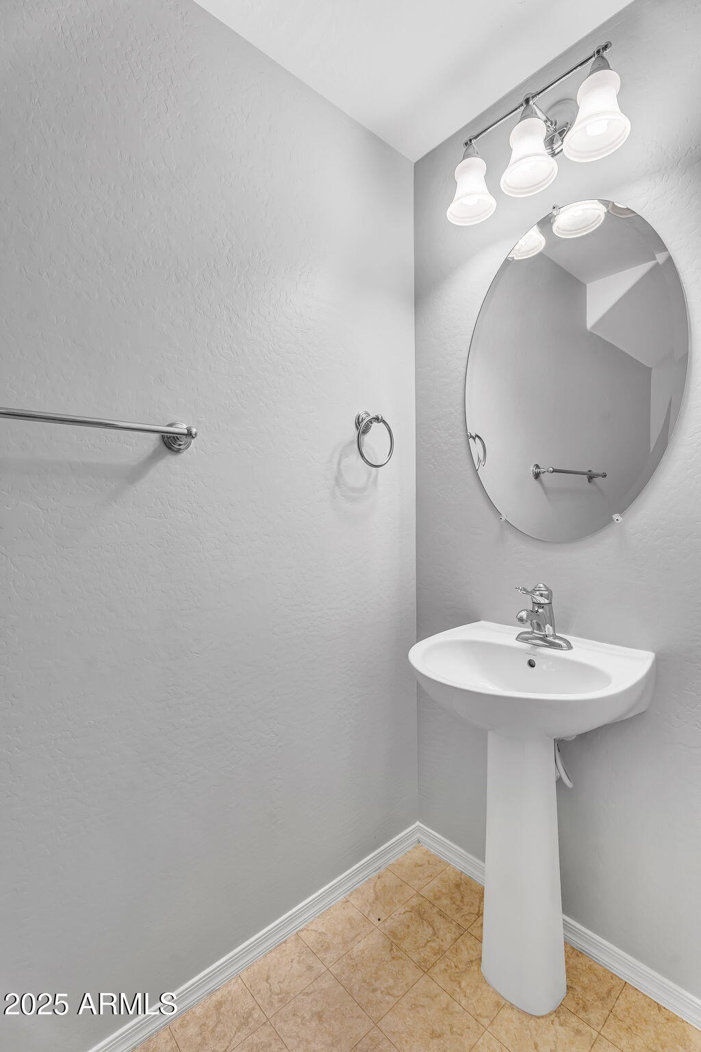 8071 West Georgetown Way Florence, AZ 85132 - Photo 7 of 43 a bathroom with a sink a mirror and vanity