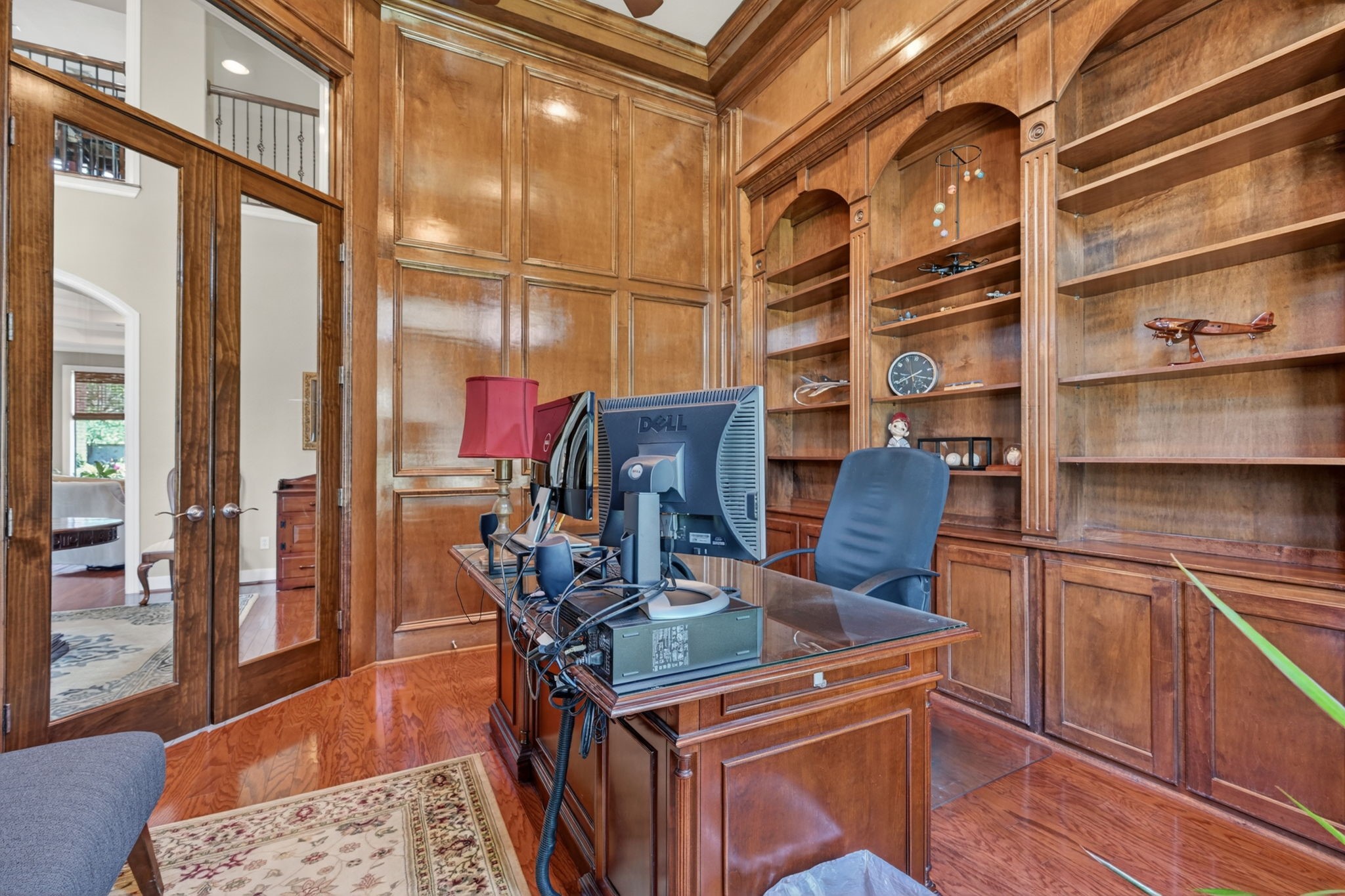 15 White Meadow Court Spring, TX 77379 - Photo 5 of 48 Gleaming paneled study with extensive built ins and double french doors with transom glass. Wood floors