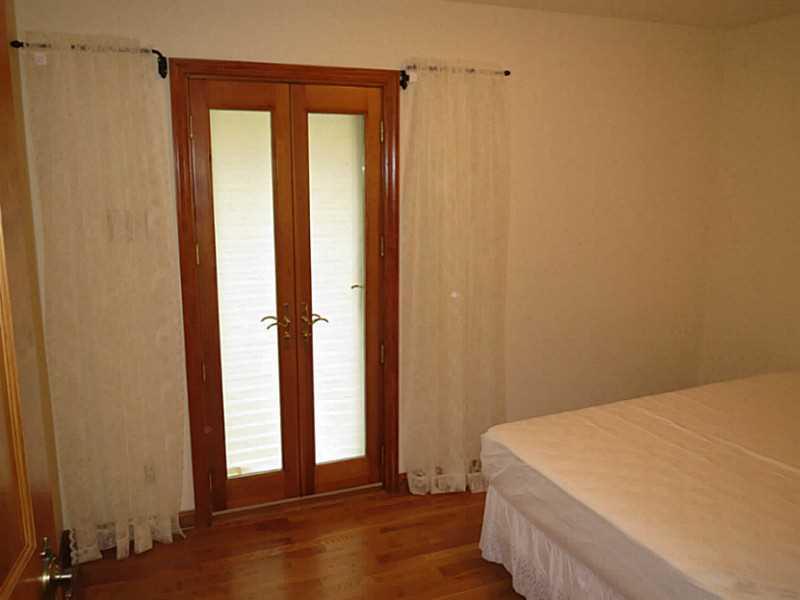 2089 Ridge Rd Extension Economy, PA 15003 - Photo 5 of 25 Bedroom. Patio doors to the back yard from third bedroom.