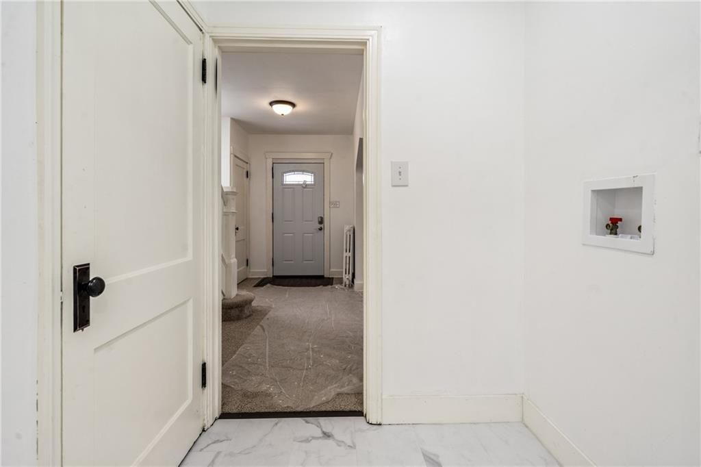 8619 Westwood Road Pittsburgh, PA 15235 - Photo 16 of 26 a view of a bathroom from a hallway