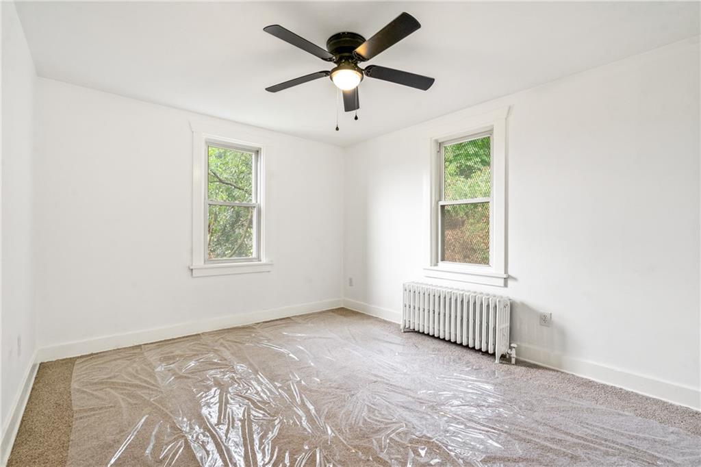 8619 Westwood Road Pittsburgh, PA 15235 - Photo 18 of 26 a view of an empty room with a window