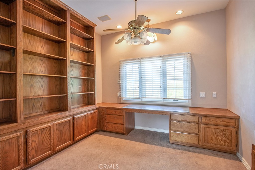 46856 El Prado Road Temecula, CA 92590 - Photo 57 of 75 a kitchen with stainless steel appliances a large window and cabinets