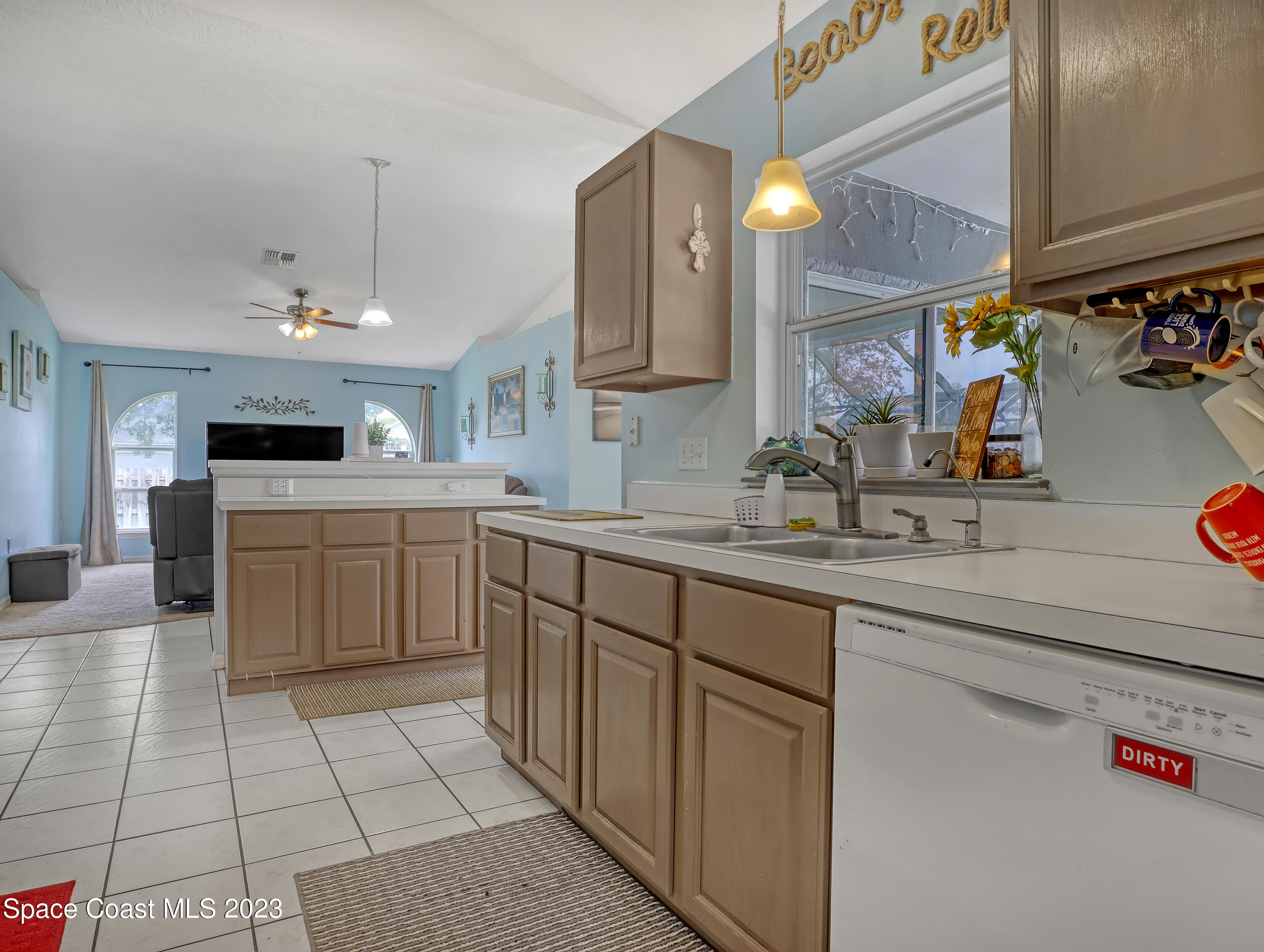 2305 Shady Oak Road Melbourne, FL 32935 - Photo 11 of 38 a kitchen with a sink cabinets and appliances