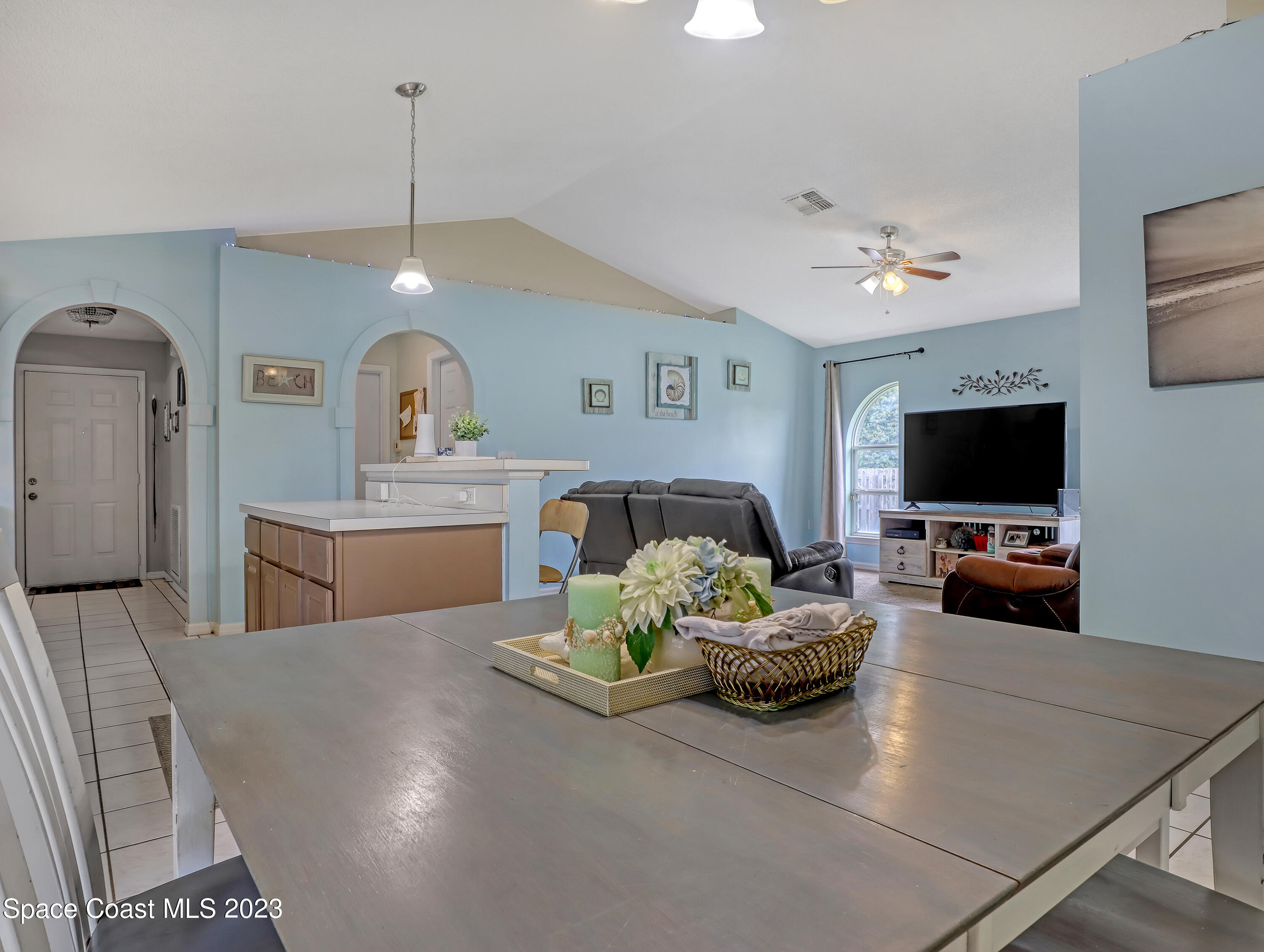 2305 Shady Oak Road Melbourne, FL 32935 - Photo 17 of 38 a living room with furniture and a flat screen tv