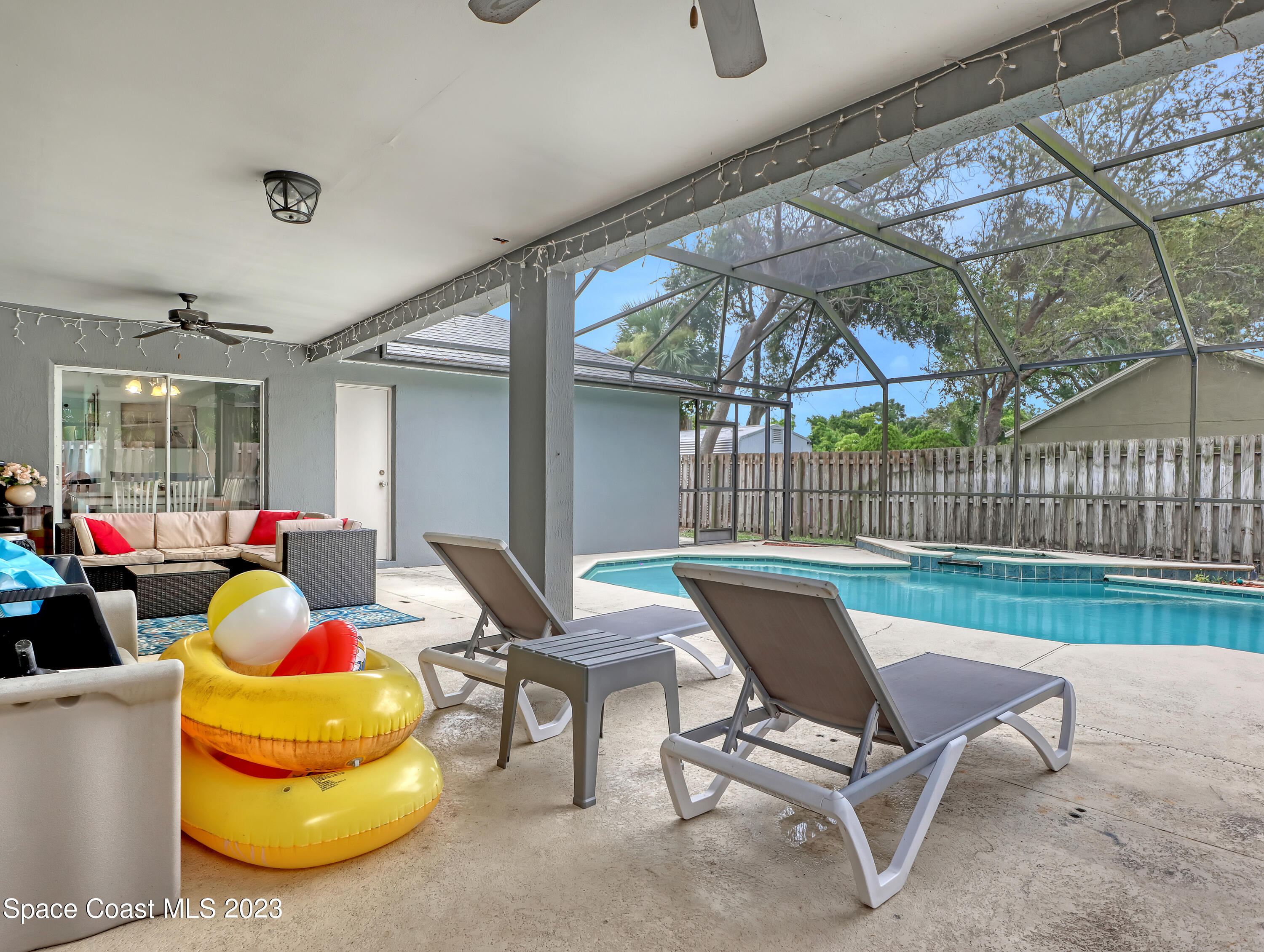 2305 Shady Oak Road Melbourne, FL 32935 - Photo 31 of 38 a building outdoor space with patio furniture and potted plants