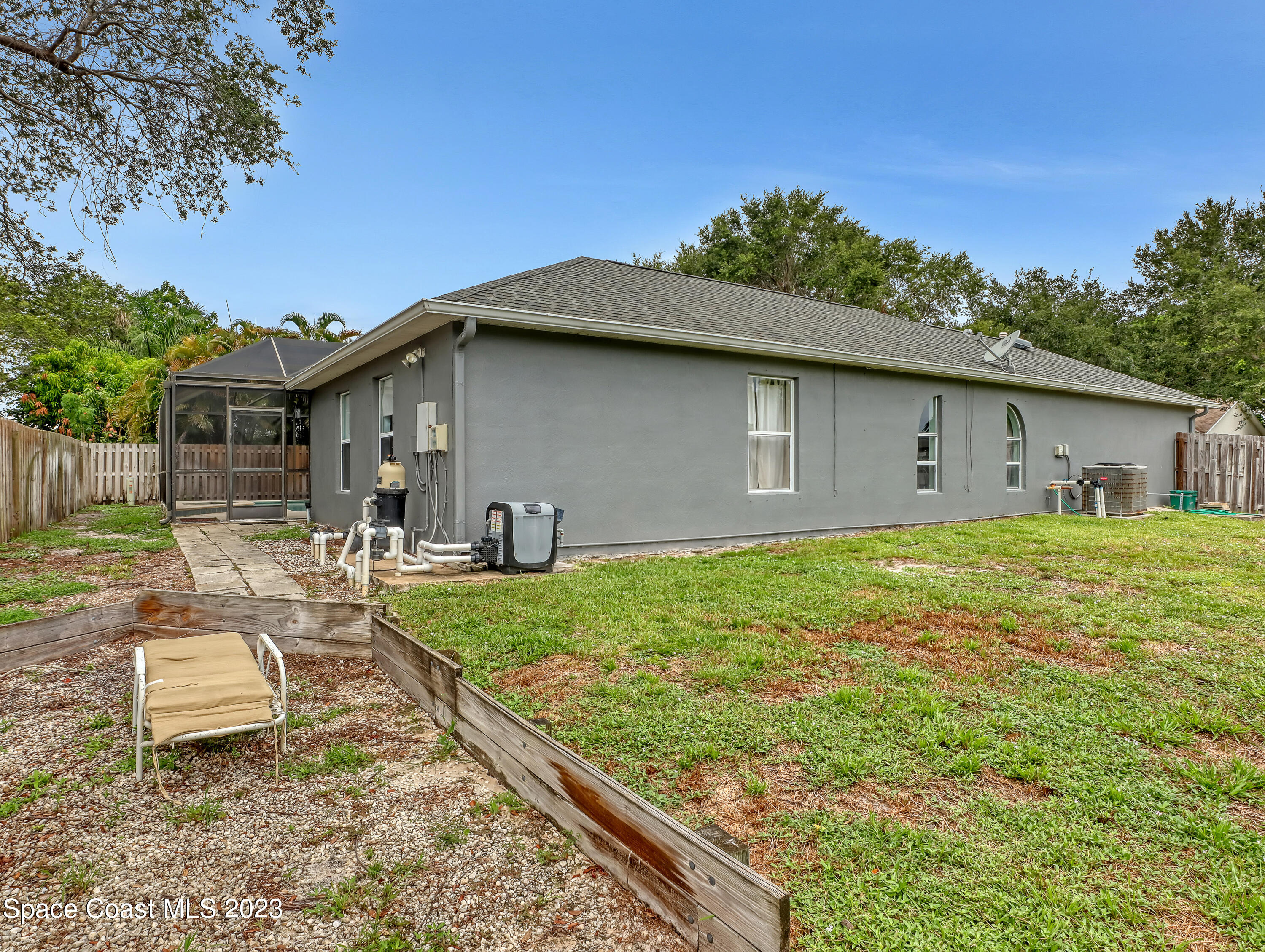 2305 Shady Oak Road Melbourne, FL 32935 - Photo 37 of 38 a front view of a house with garden
