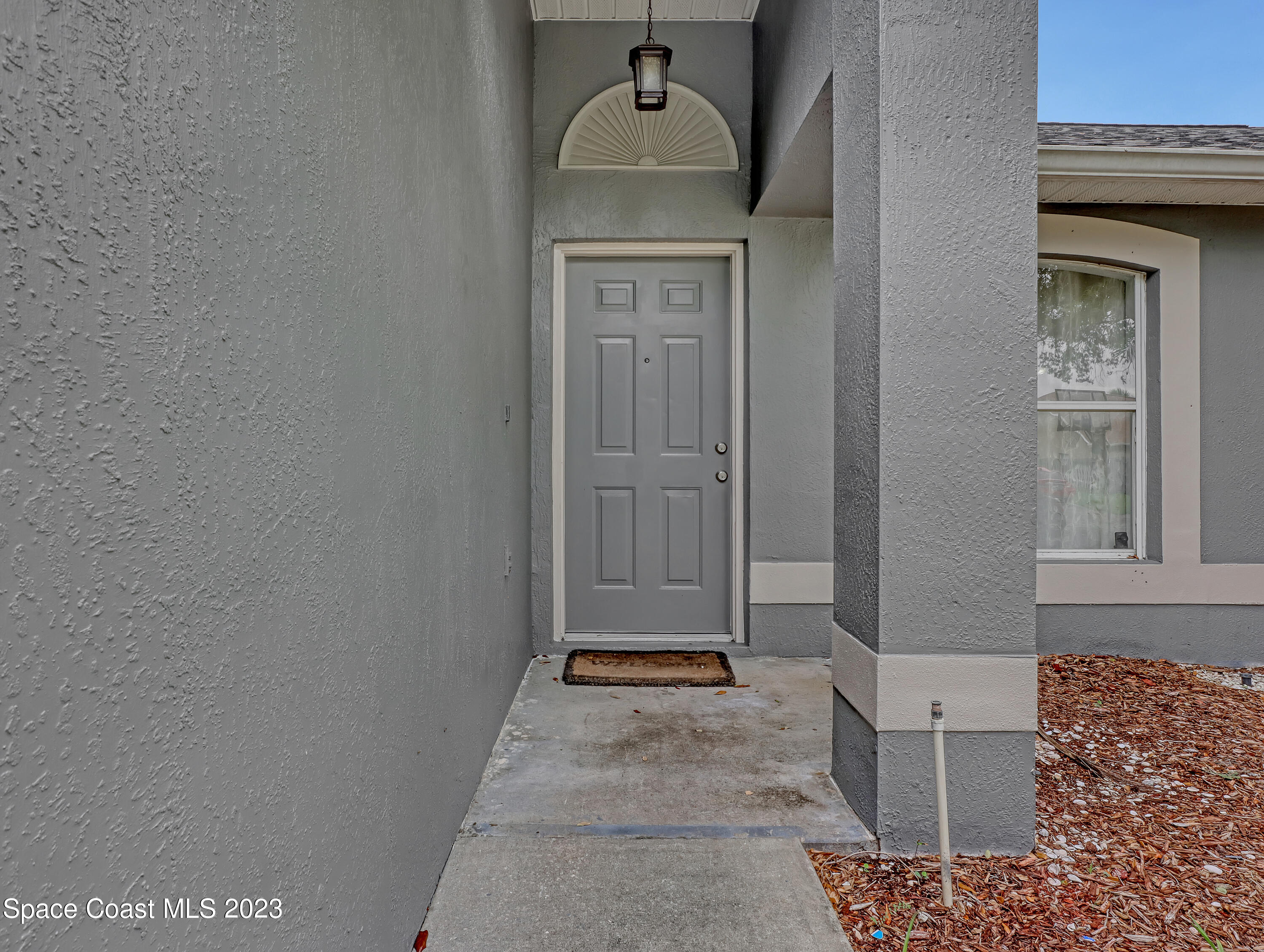 2305 Shady Oak Road Melbourne, FL 32935 - Photo 4 of 38 a view of a door and a sink