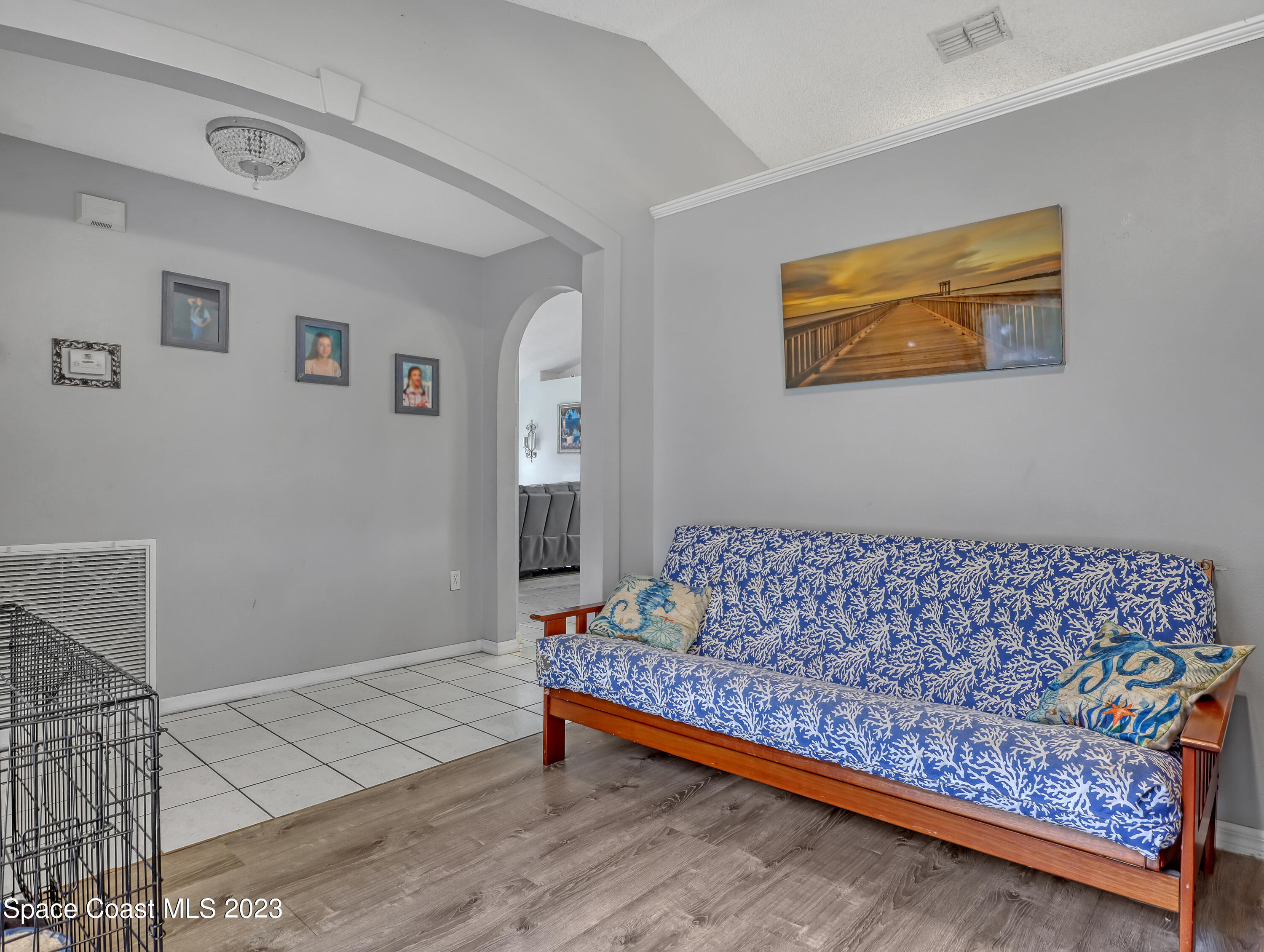 2305 Shady Oak Road Melbourne, FL 32935 - Photo 6 of 38 a bed sitting in a bedroom next to a window