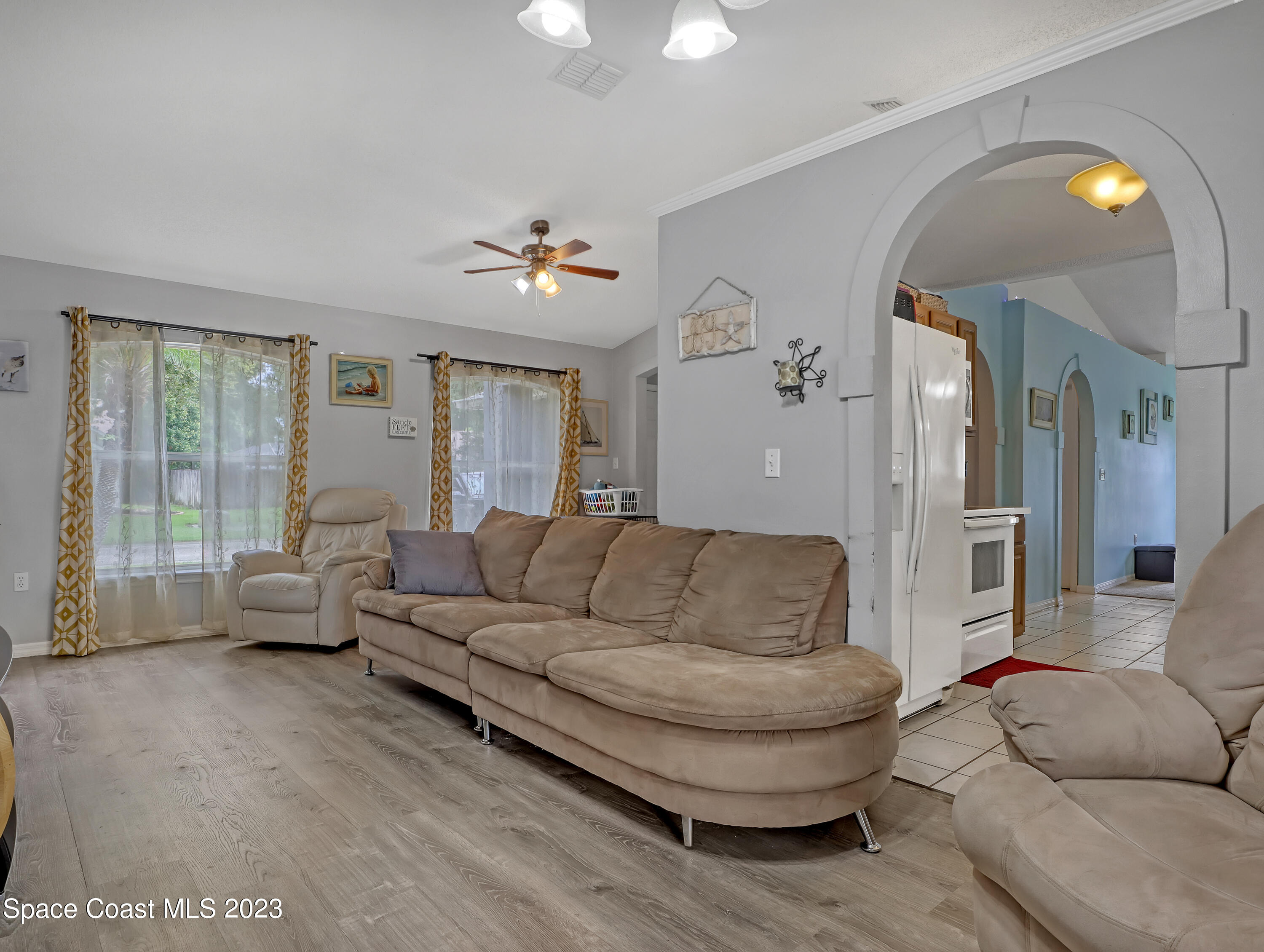 2305 Shady Oak Road Melbourne, FL 32935 - Photo 8 of 38 a living room with furniture and a large window
