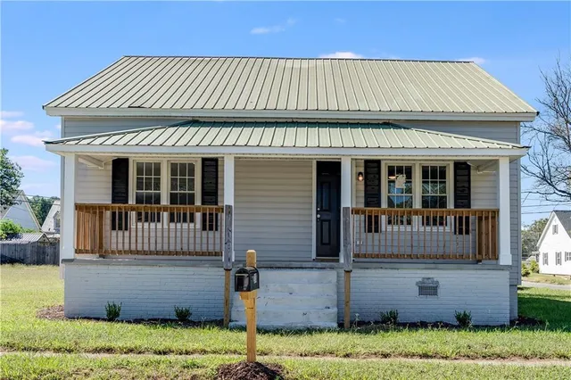 front view of a house with a yard