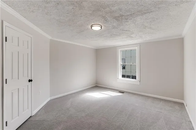 an empty room with a empty space and windows