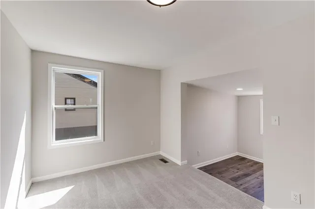 a view of an empty room and window