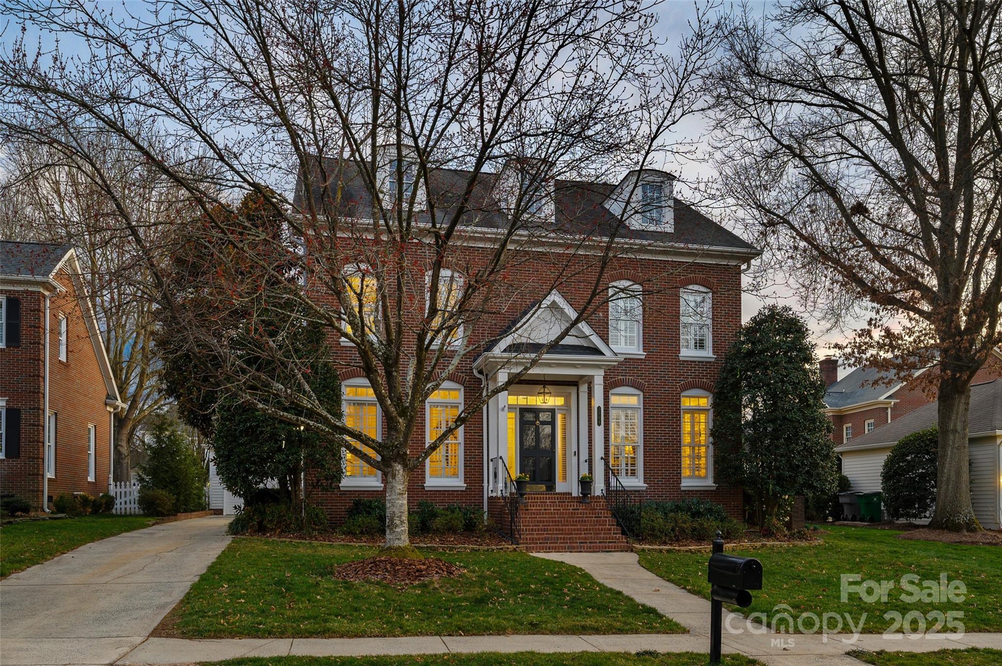 7704 Sharpthorne Place Charlotte, NC 28270 - Photo 1 of 34 a front view of a house with garden