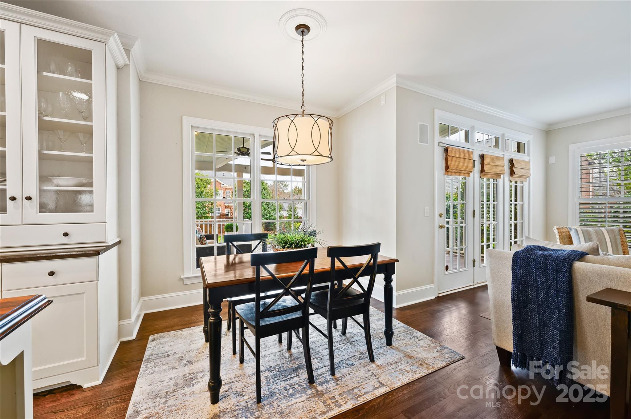7704 Sharpthorne Place Charlotte, NC 28270 - Photo 15 of 34 a dining room with furniture window wooden floor