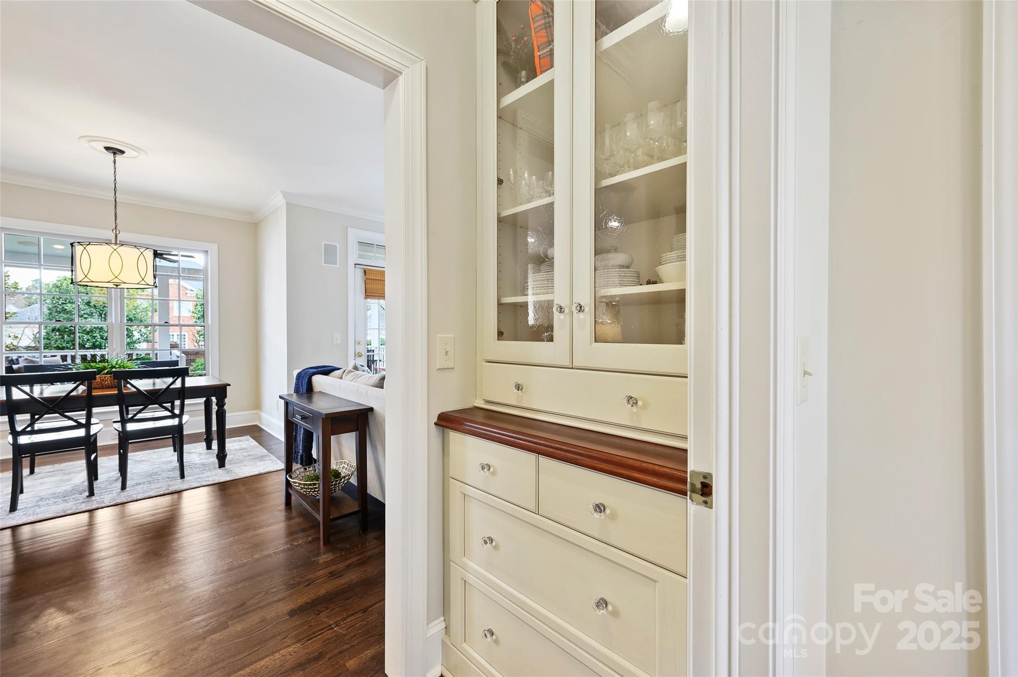 7704 Sharpthorne Place Charlotte, NC 28270 - Photo 16 of 34 a hallway with a large window dining table and chairs