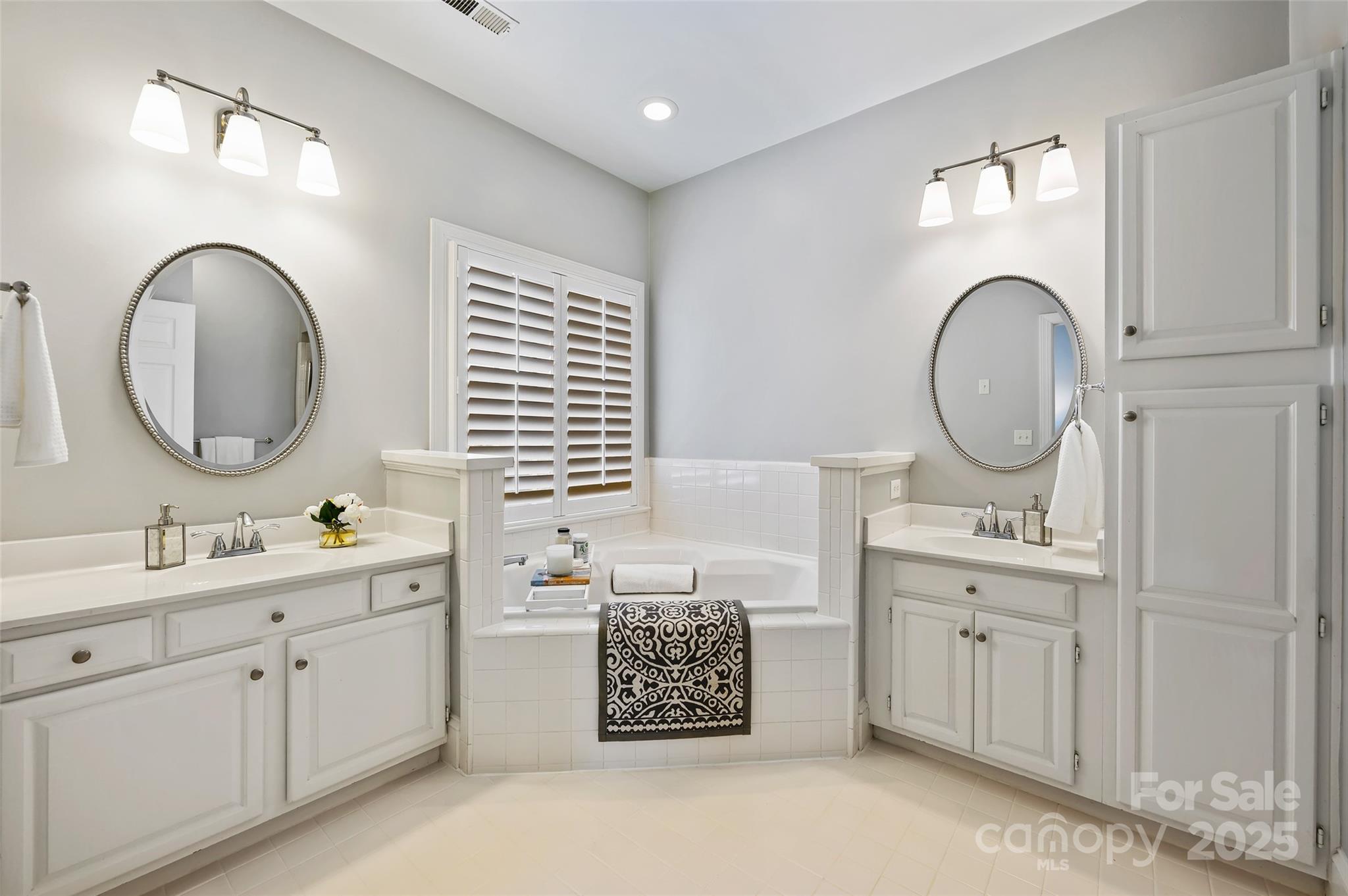 7704 Sharpthorne Place Charlotte, NC 28270 - Photo 21 of 34 a bathroom with a sink and a mirror