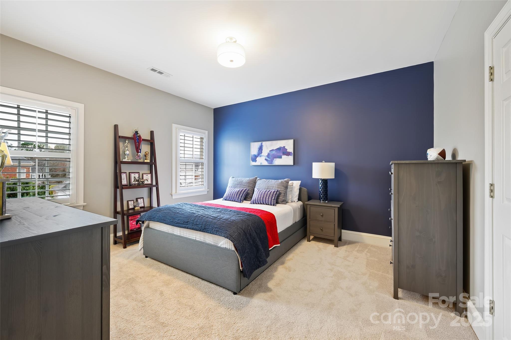 7704 Sharpthorne Place Charlotte, NC 28270 - Photo 22 of 34 a spacious bedroom with a bed and a large window