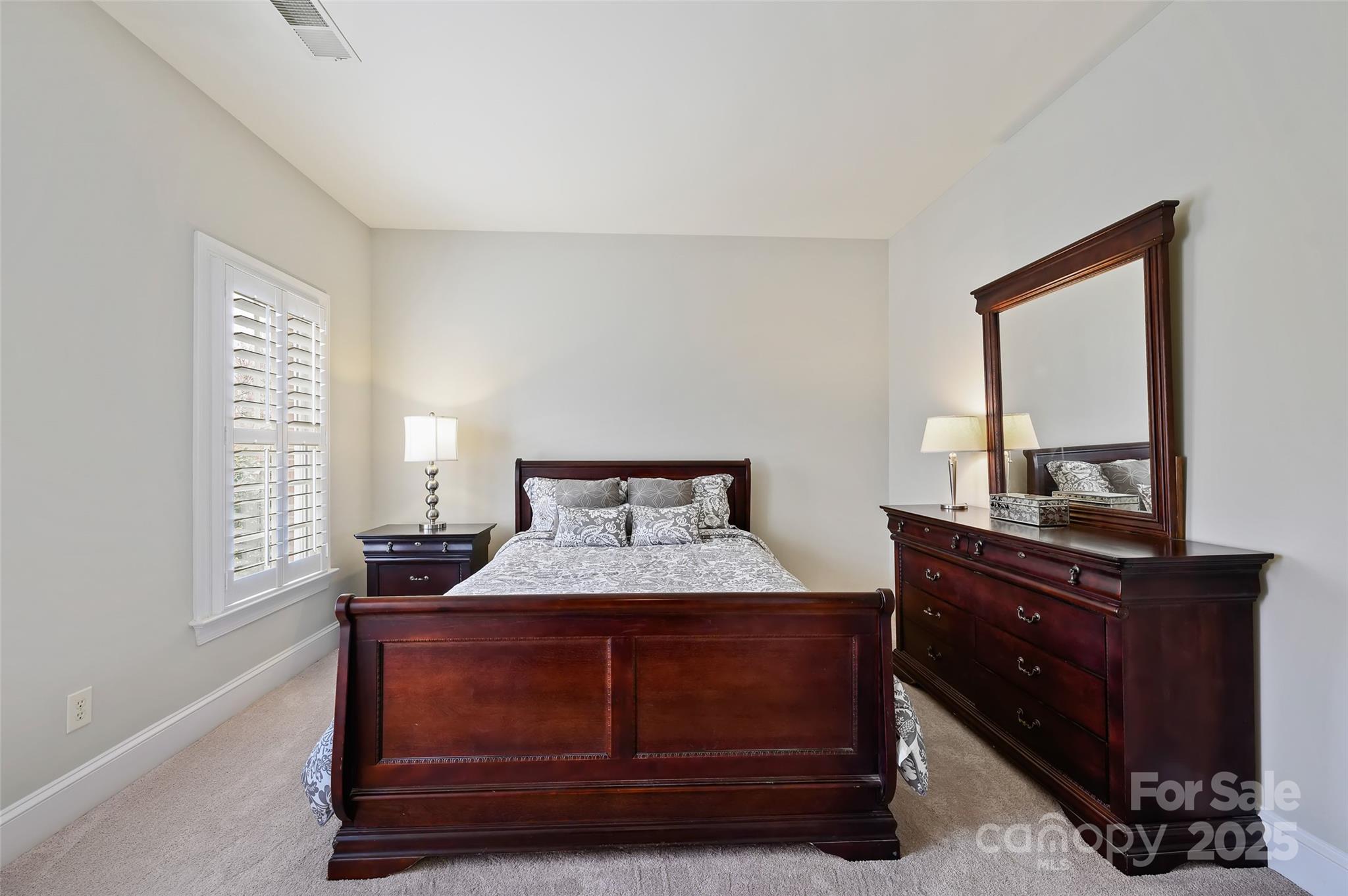 7704 Sharpthorne Place Charlotte, NC 28270 - Photo 24 of 34 a bedroom with a bed and window