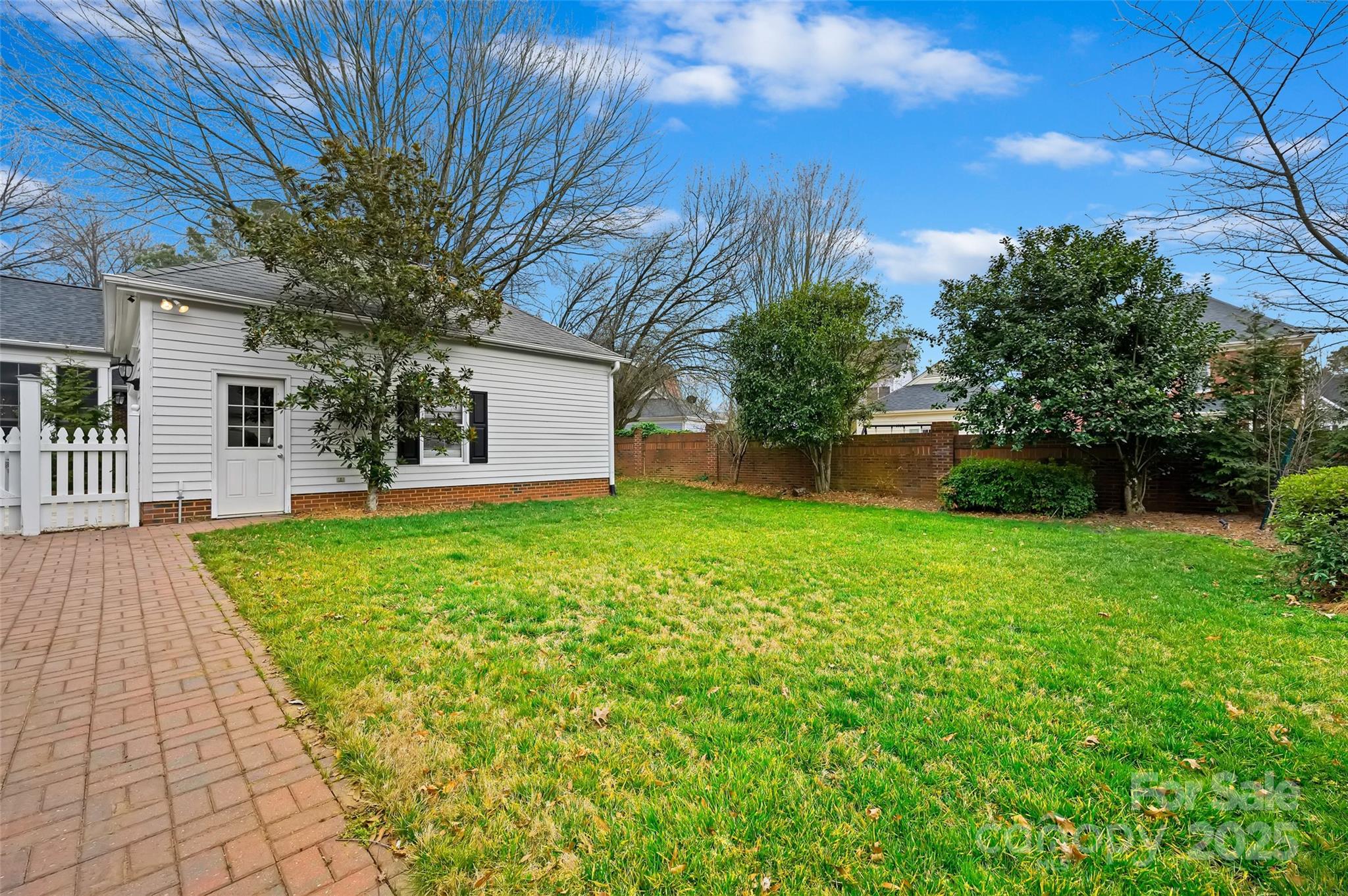 7704 Sharpthorne Place Charlotte, NC 28270 - Photo 29 of 34 a view of a backyard with a garden