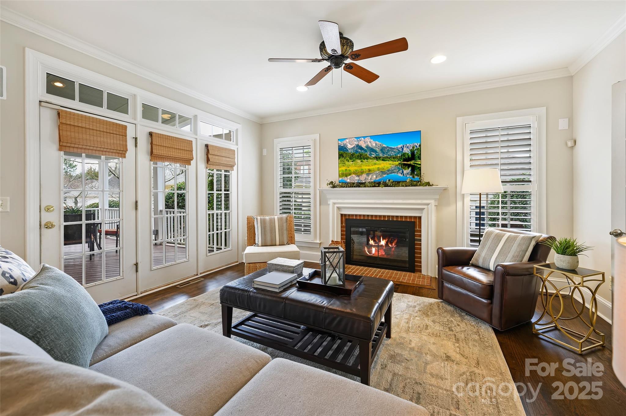 7704 Sharpthorne Place Charlotte, NC 28270 - Photo 4 of 34 a living room with furniture a large window and a fireplace