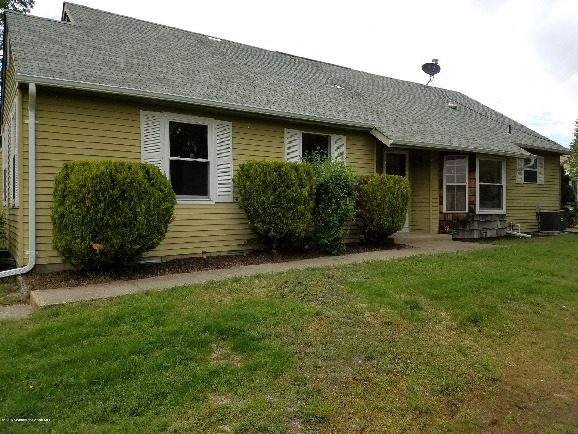 12B Alpine Road, Unit B Whiting, NJ 08759 - Photo 2 of 14 a front view of a house with garden